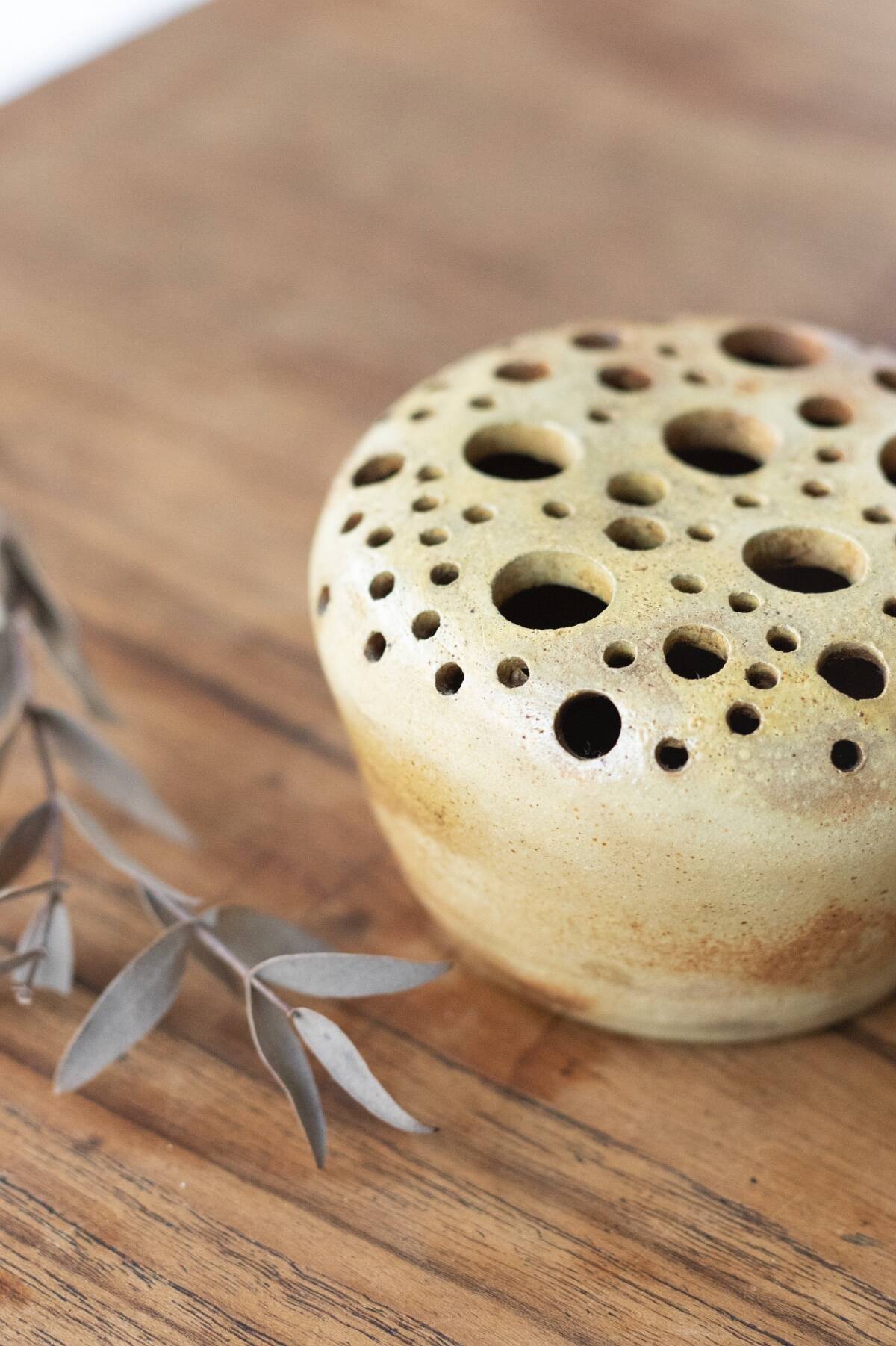 Signed sandstone flower pick