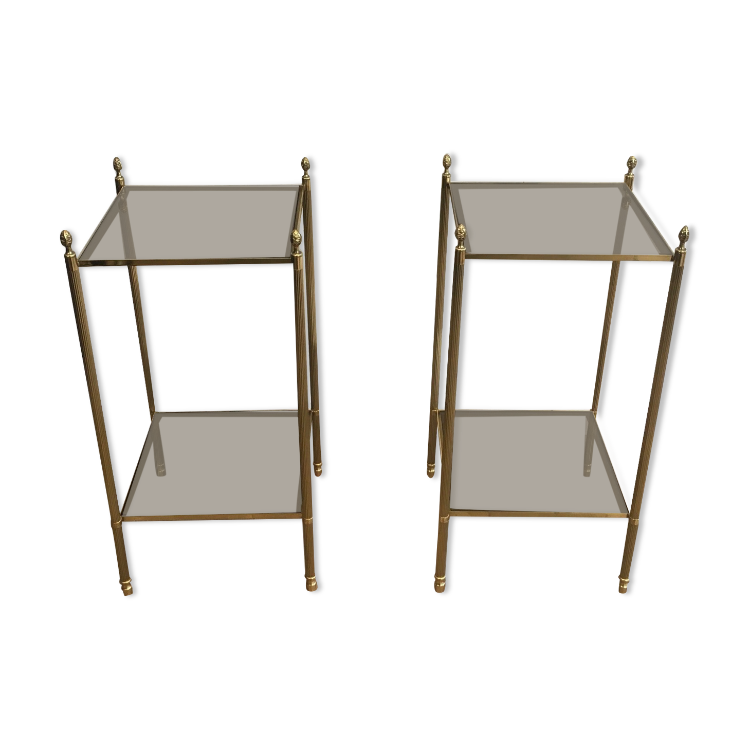 Pair of neoclassical style sofa ends in gilded metal and glass