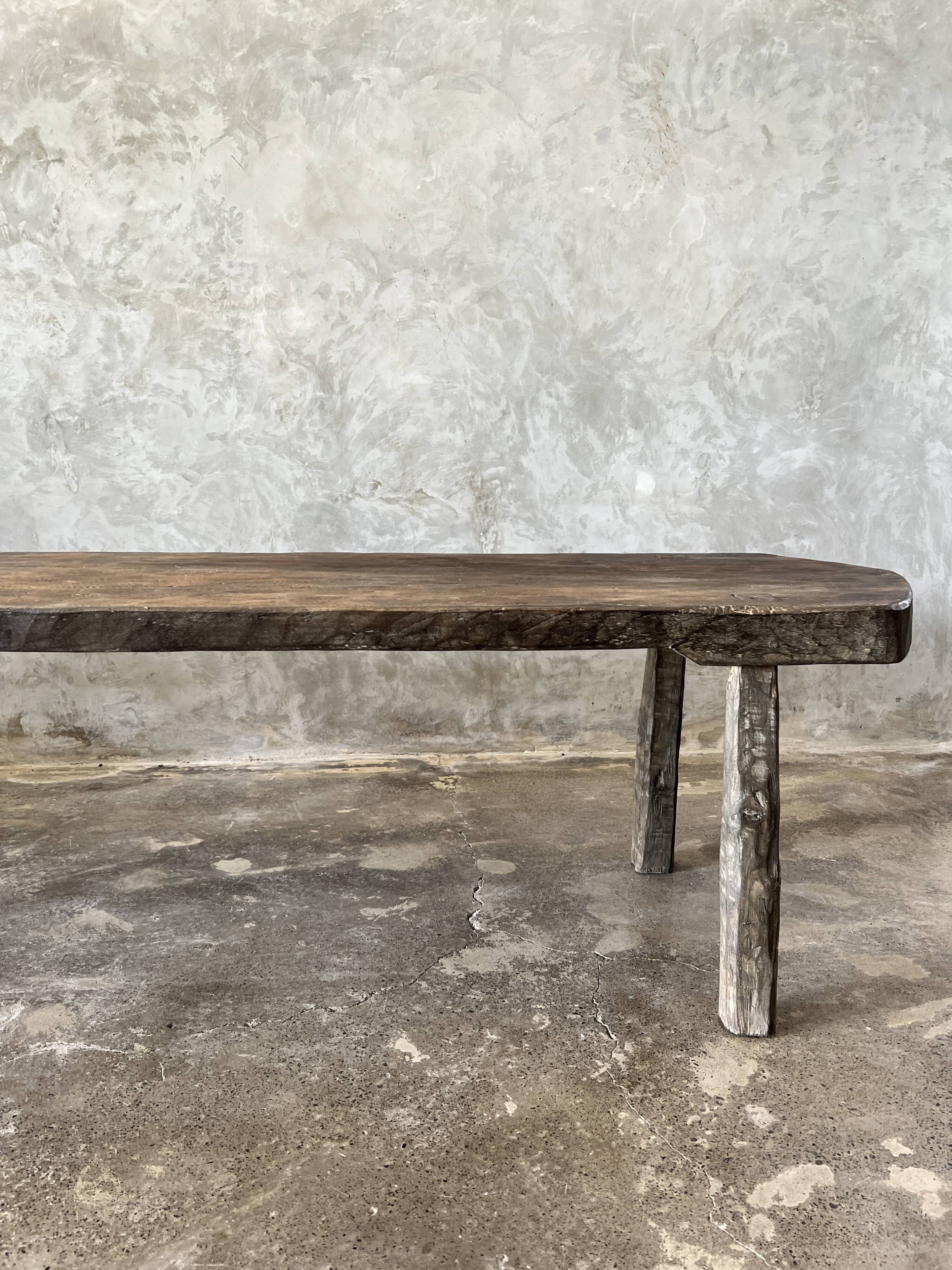 Large rounded coffee table in old Asian teak
