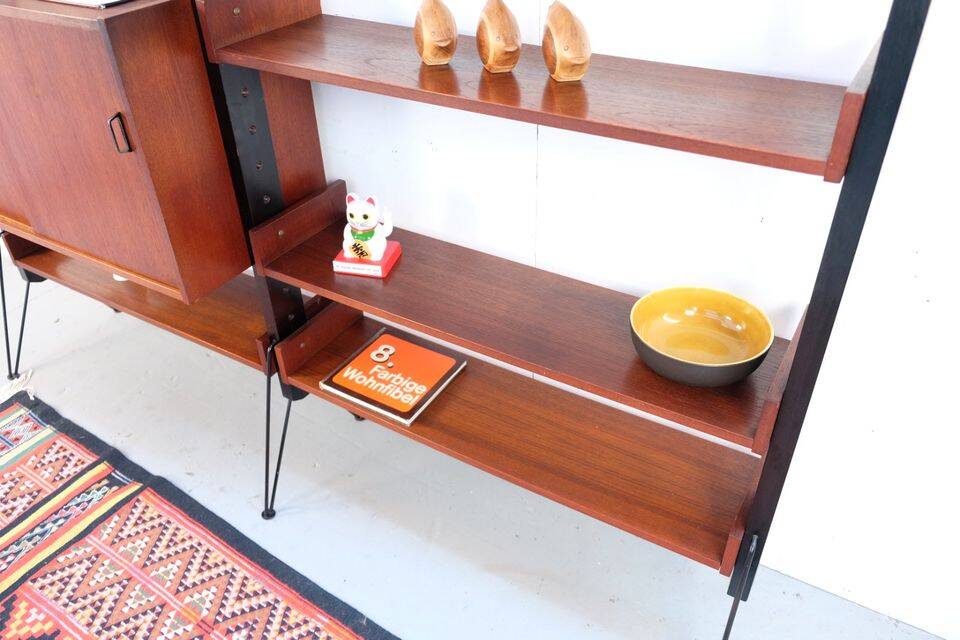 Vintage teak shelving system in 60s-70s style, retro style.