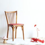 Bistro chair with bars of the 50s in wood and imitation red leather