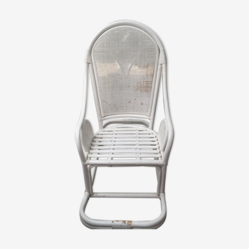 White rocking chair in rattan and canning