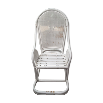 White rocking chair in rattan and canning