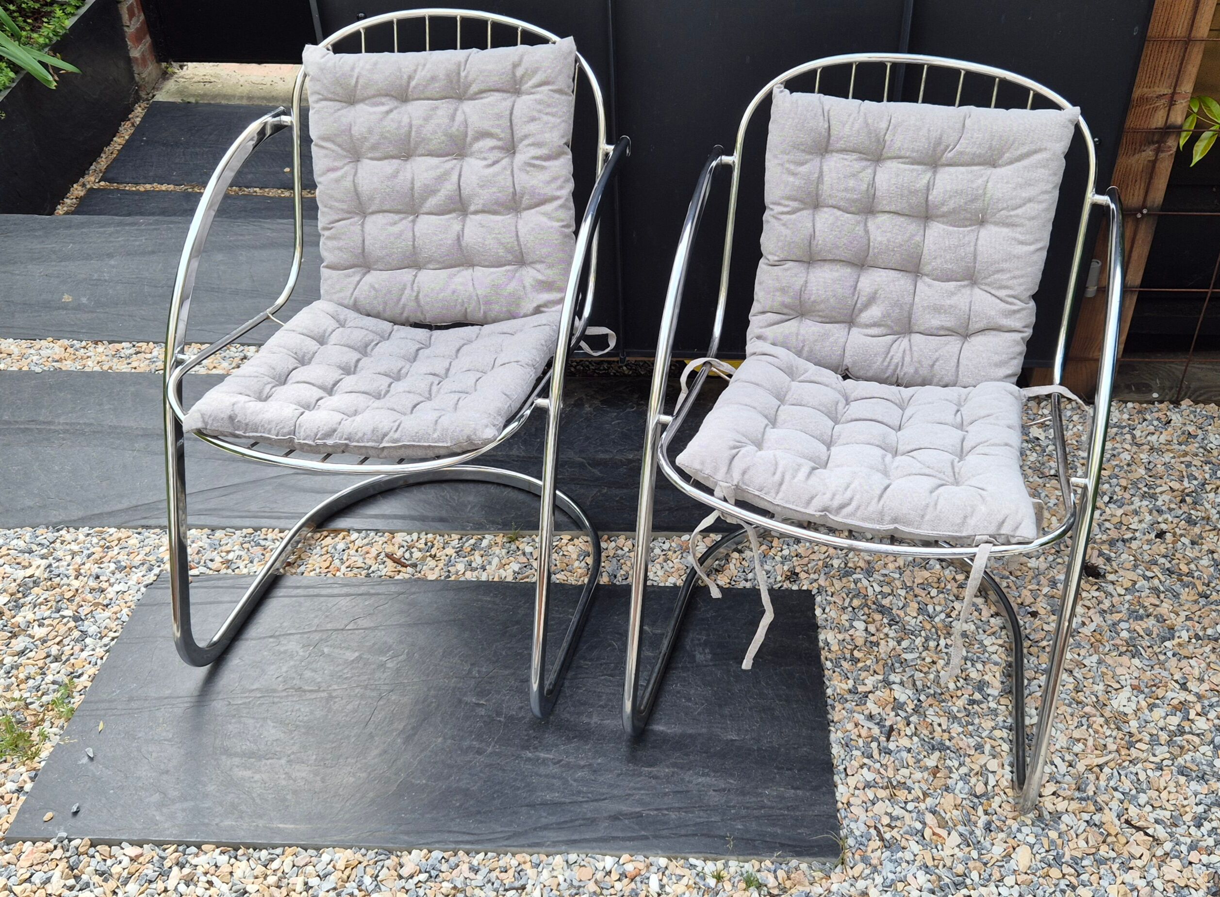 A pair of space age wire chairs