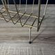 Mid-century magazine rack in golden metal wire