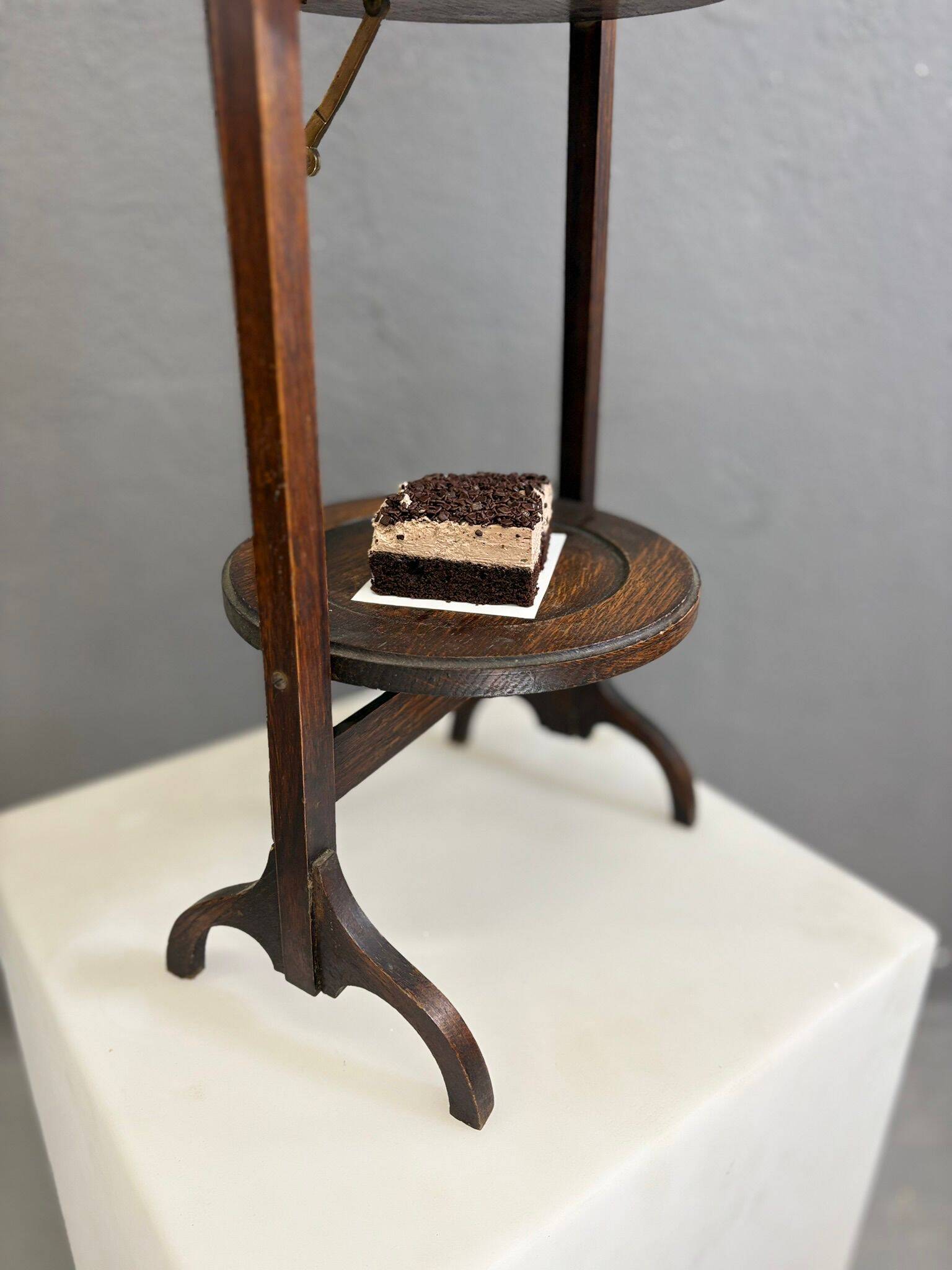 Vintage 3-tier cake stand in dark wood, 1920s serving display.