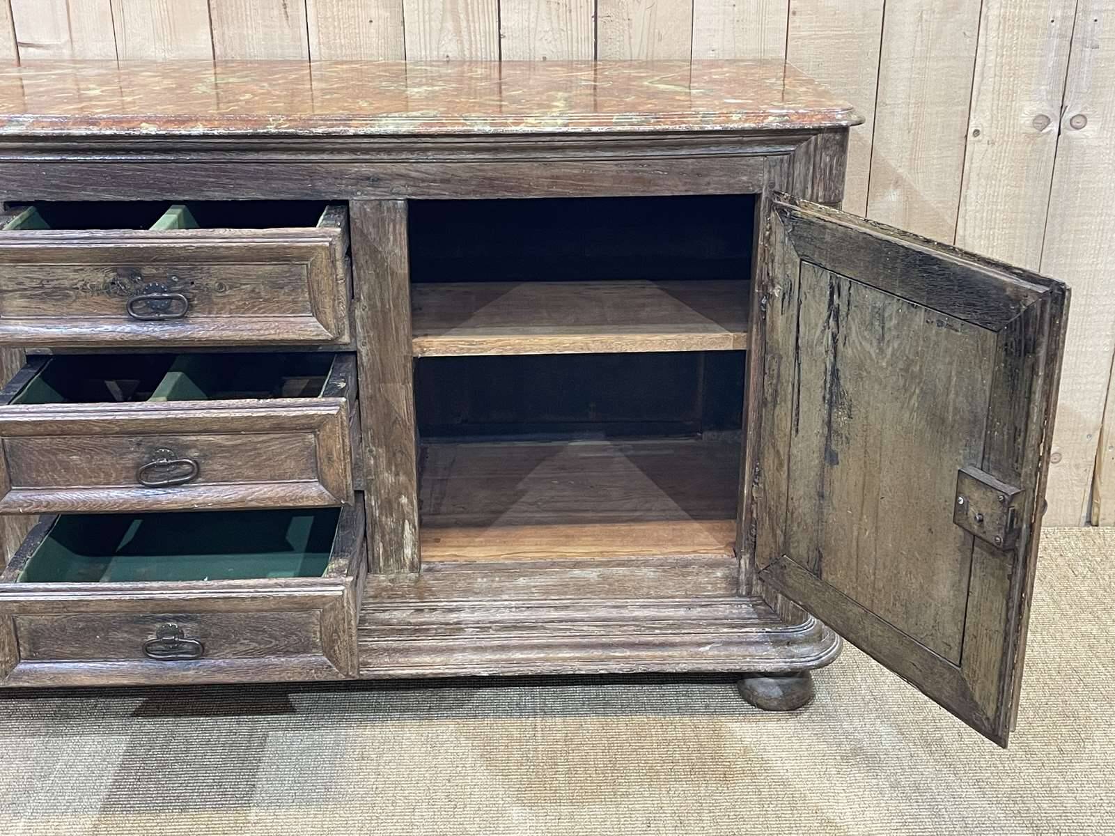 18th-century oak enfilade with a marble-effect painted top.