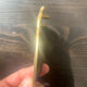 Empty brass pocket owl