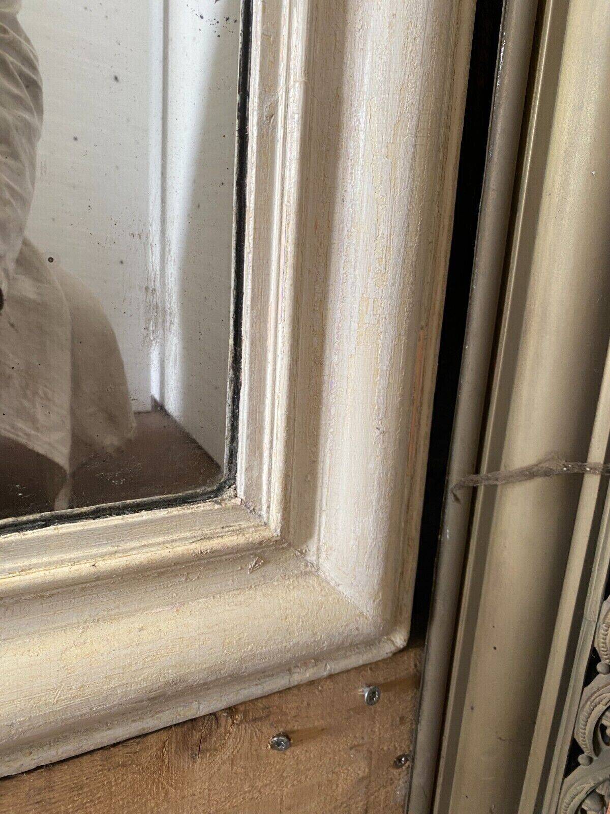 Louis Philippe mirror in wood and patinated stucco 19th century