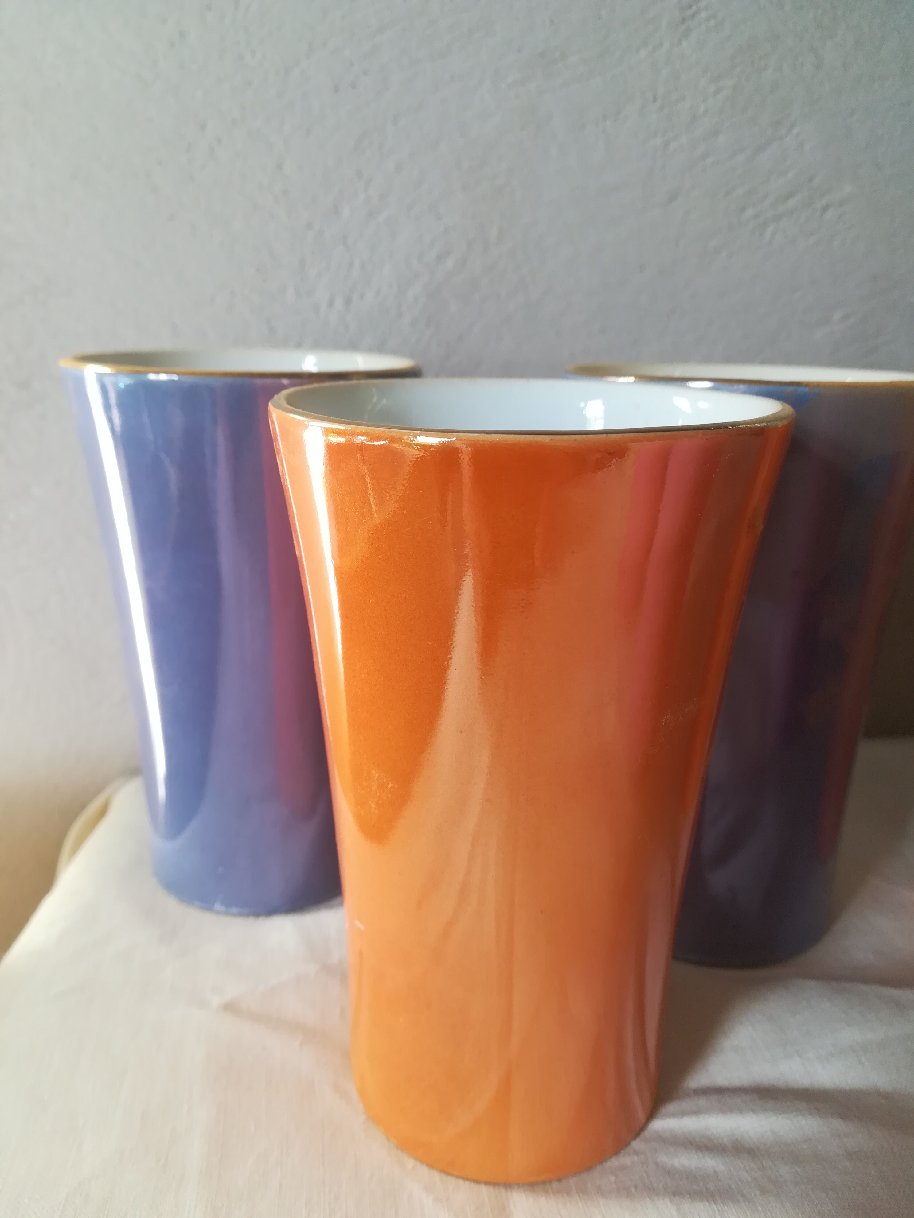 8 coloured cups in earthenware