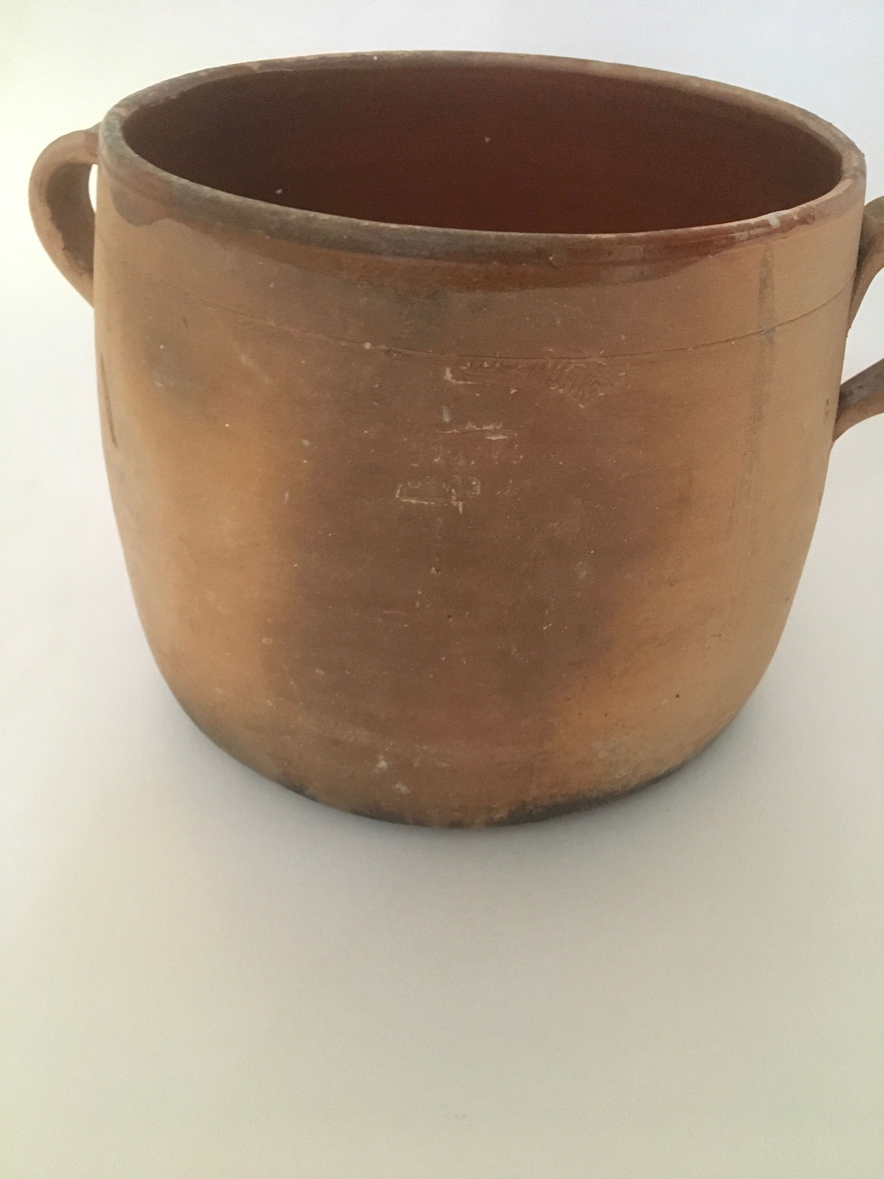 Terracotta marmite and enamelled interior