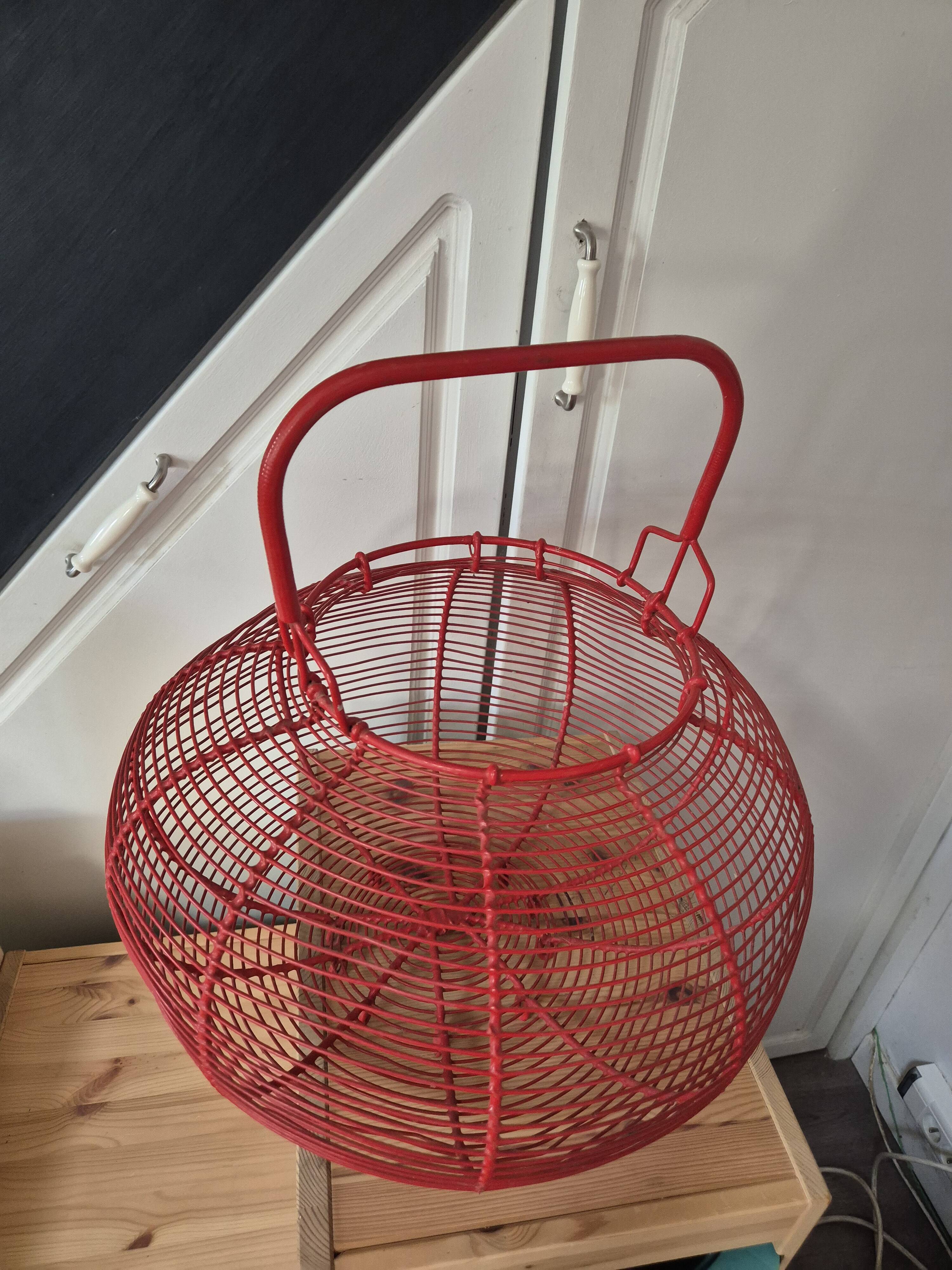 very large vintage red metal basket with handle