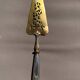 Silver cake server with gilded metal, pierced blade, 19th century.