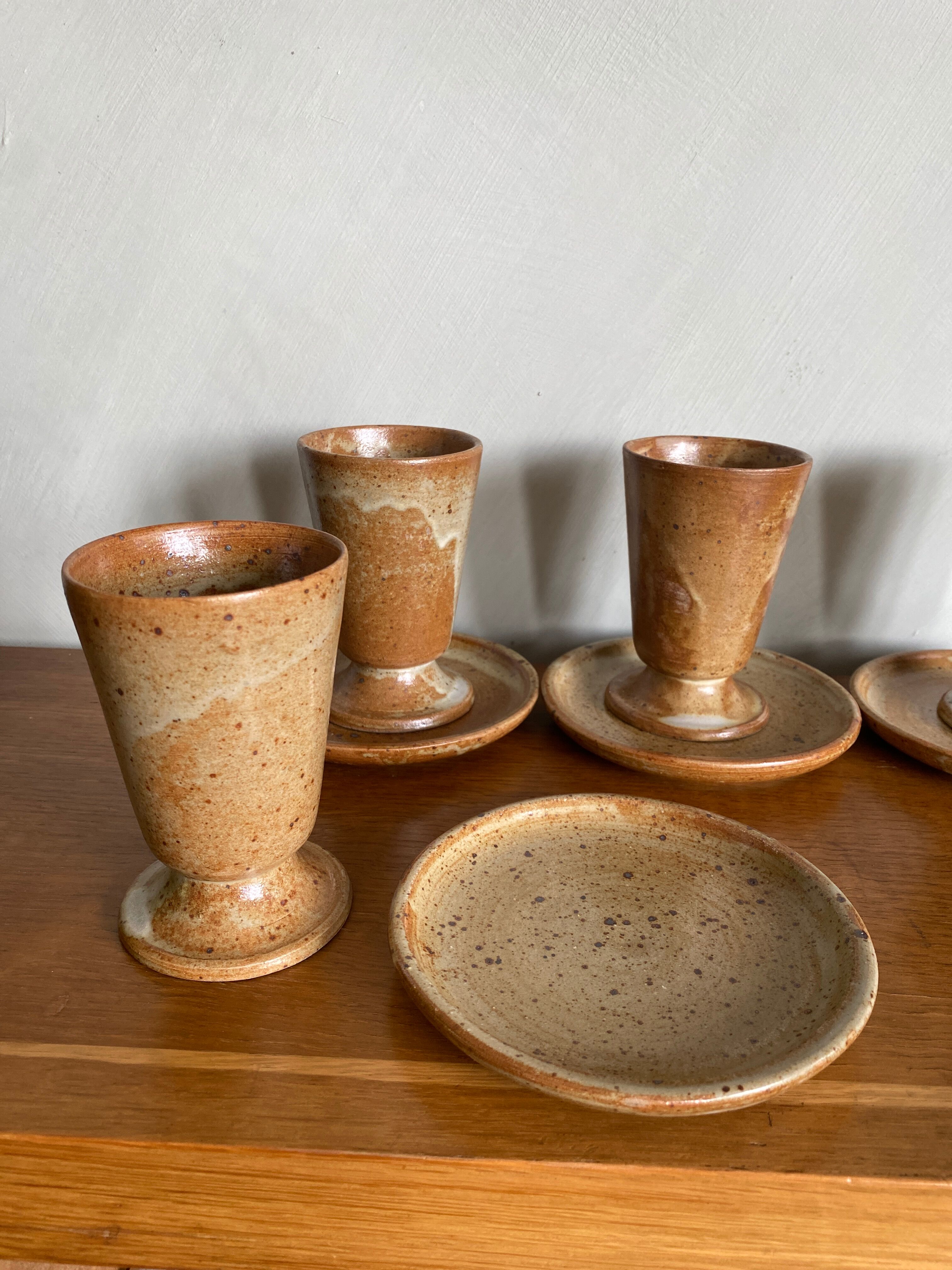 Set of 4 vintage stoneware coffee cups and plates