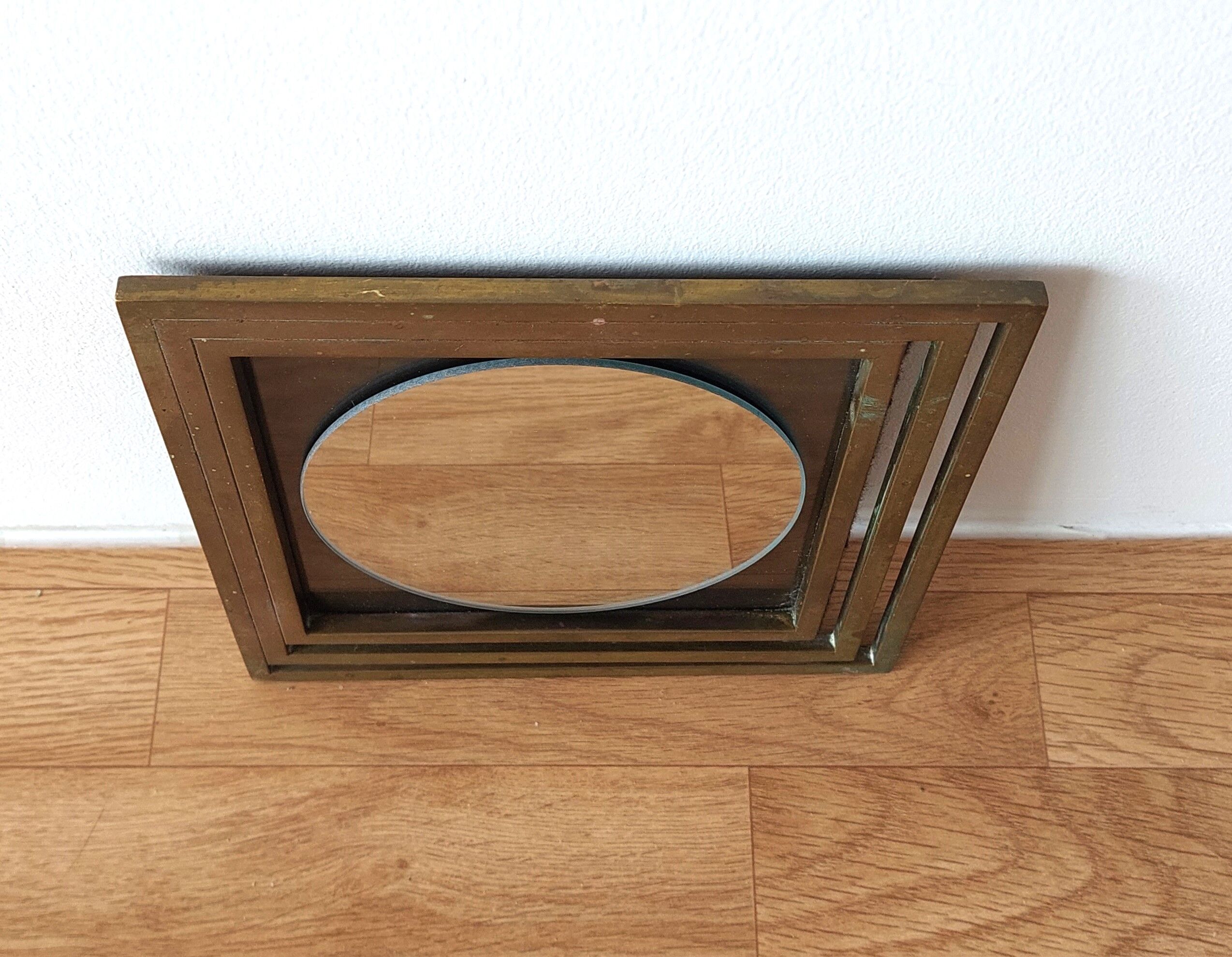 Modernist mirror in gilded brass 1960.