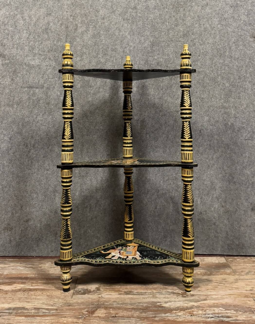India circa 1900: attractive corner shelf in lacquered and painted wood