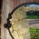 Art Deco mirror in wrought iron and beveled glass