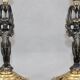 Pair of candle holders in gilded bronze and patinated with a candle