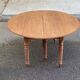 Round extendable banquet table stripped in solid mahogany with 4 extensions, 19th century.