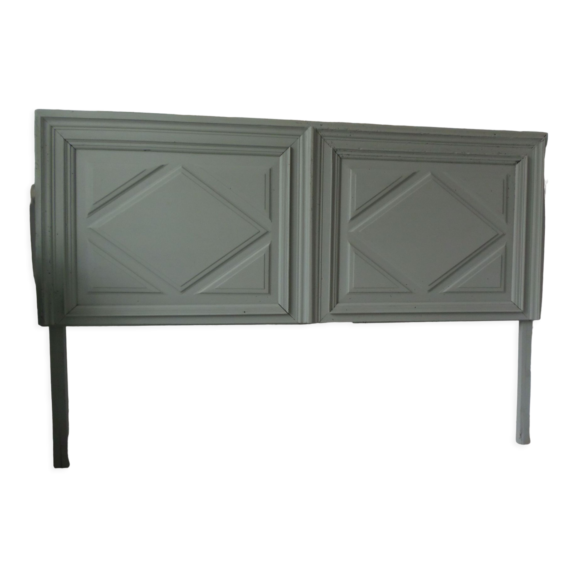 Headboard made with an old walnut door, re-enchanted in gray green waxed finish,