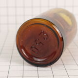 Rummaging in brown glass bottle