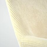 Cream corduroy swivel shell armchairs