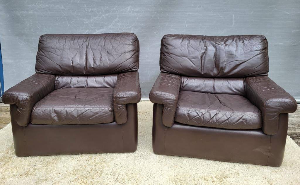 Pair of chocolate leather lounge chairs