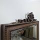 Louis XVI style mirror in carved walnut.