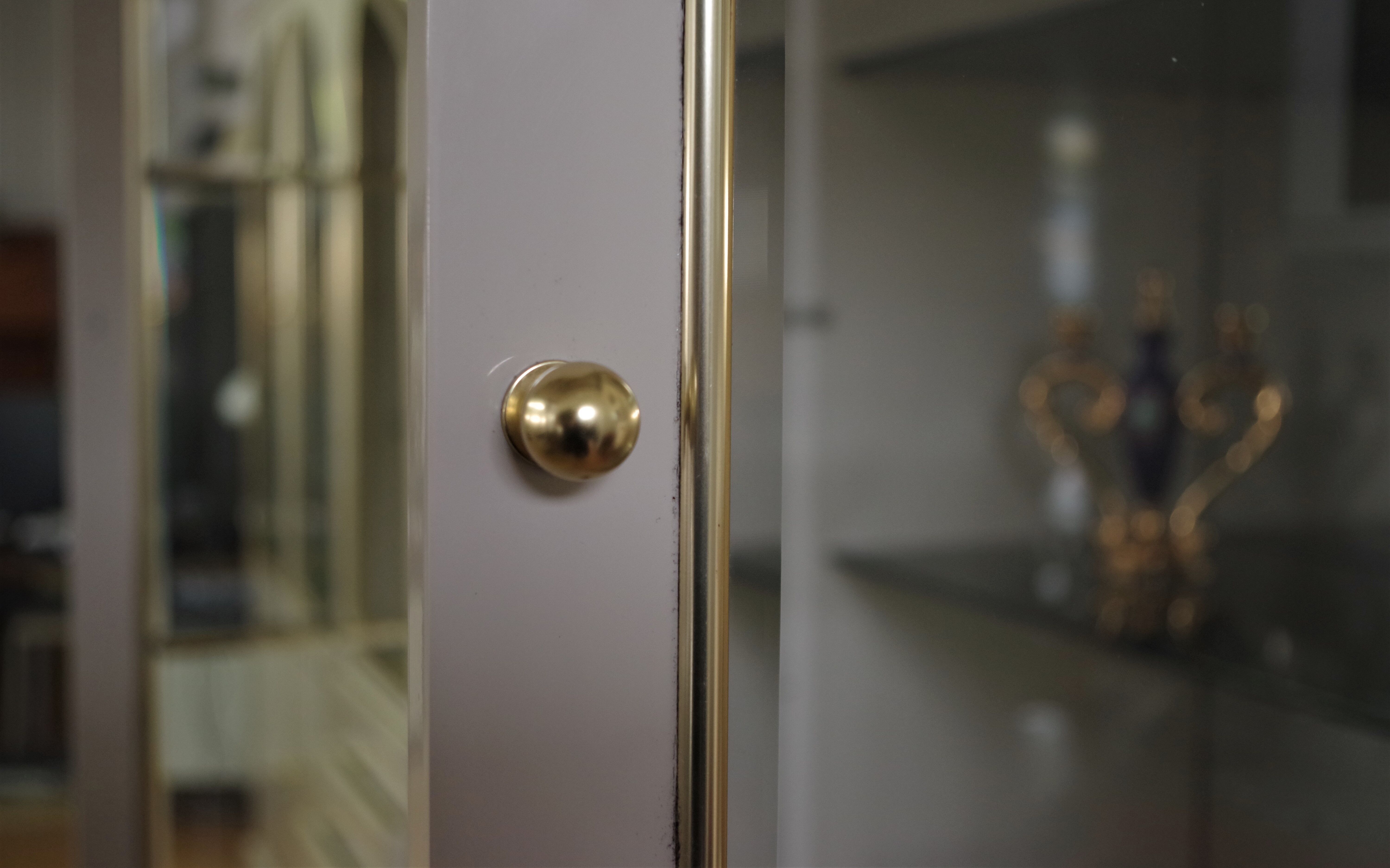 Showcases in lacquered wood, glass and brass  1970s, set of 4