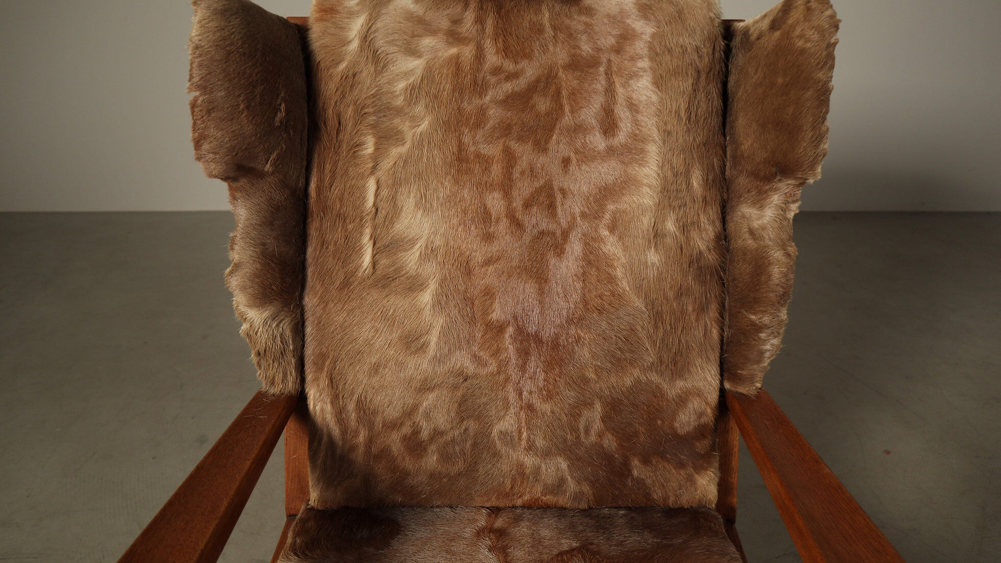 Brutalist oak lounge chair and ottoman in original goat hide, 1960s