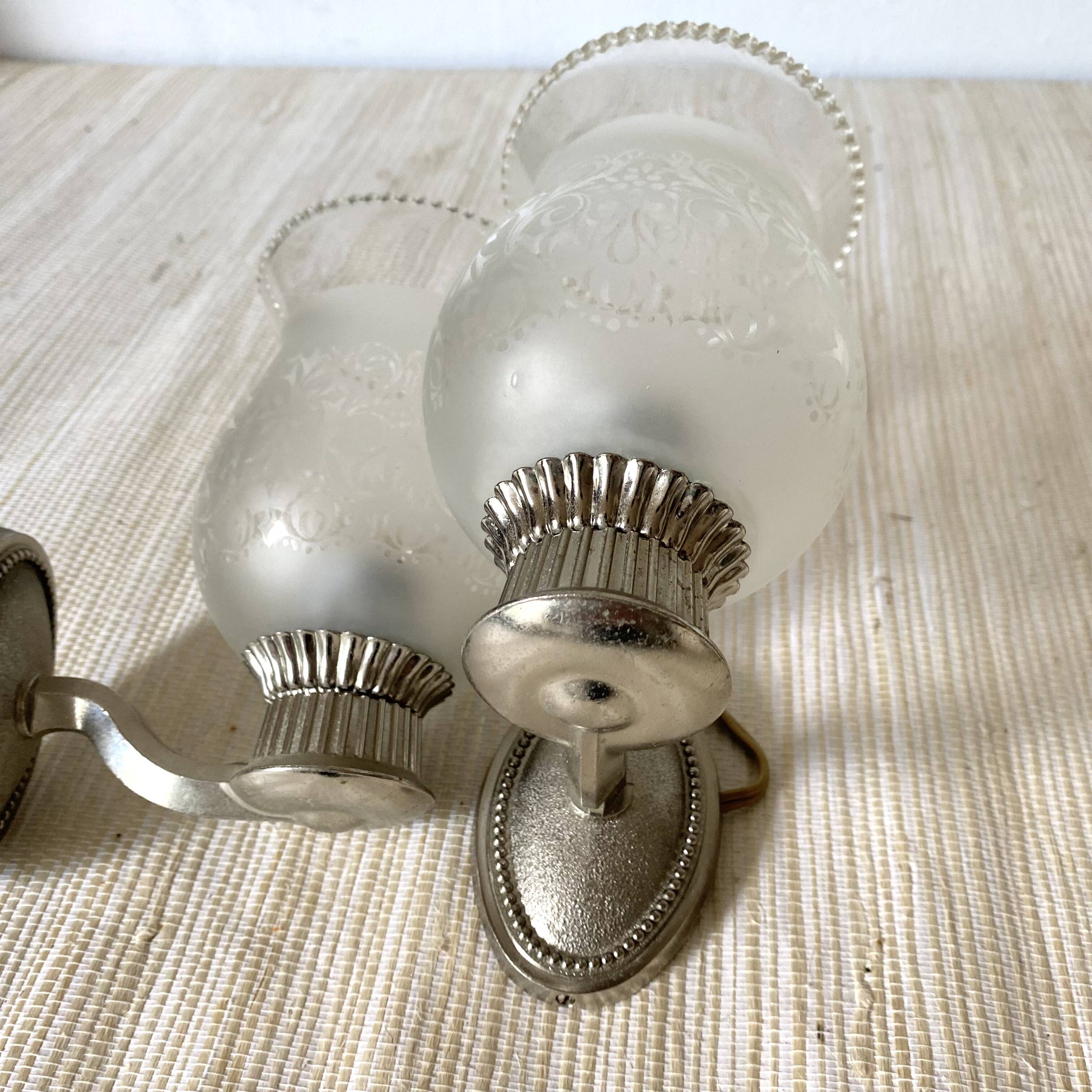 Pair of metal and glass wall lights