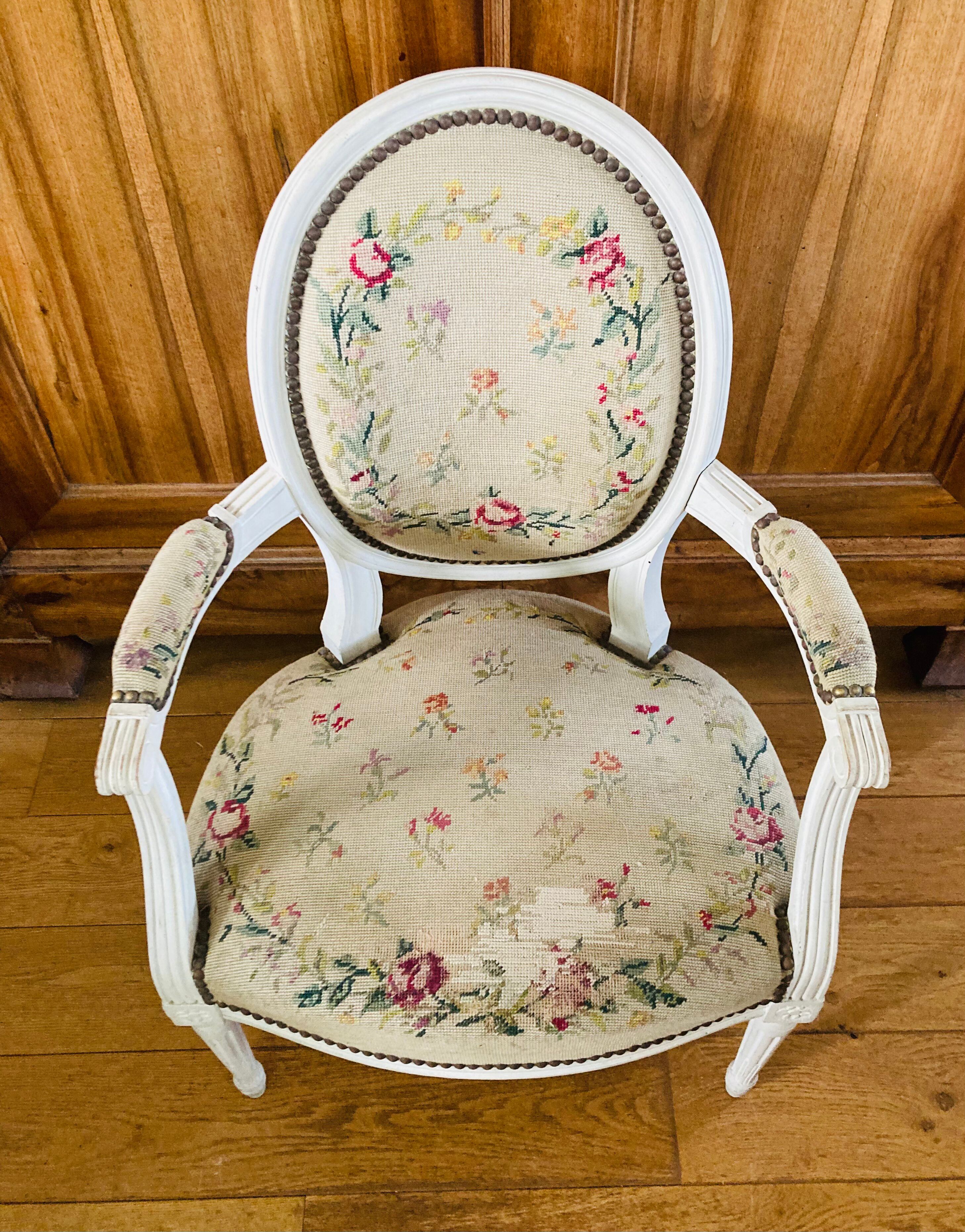 Upholstered armchair with cross-stitch in the Louis XVI style, 19th century.