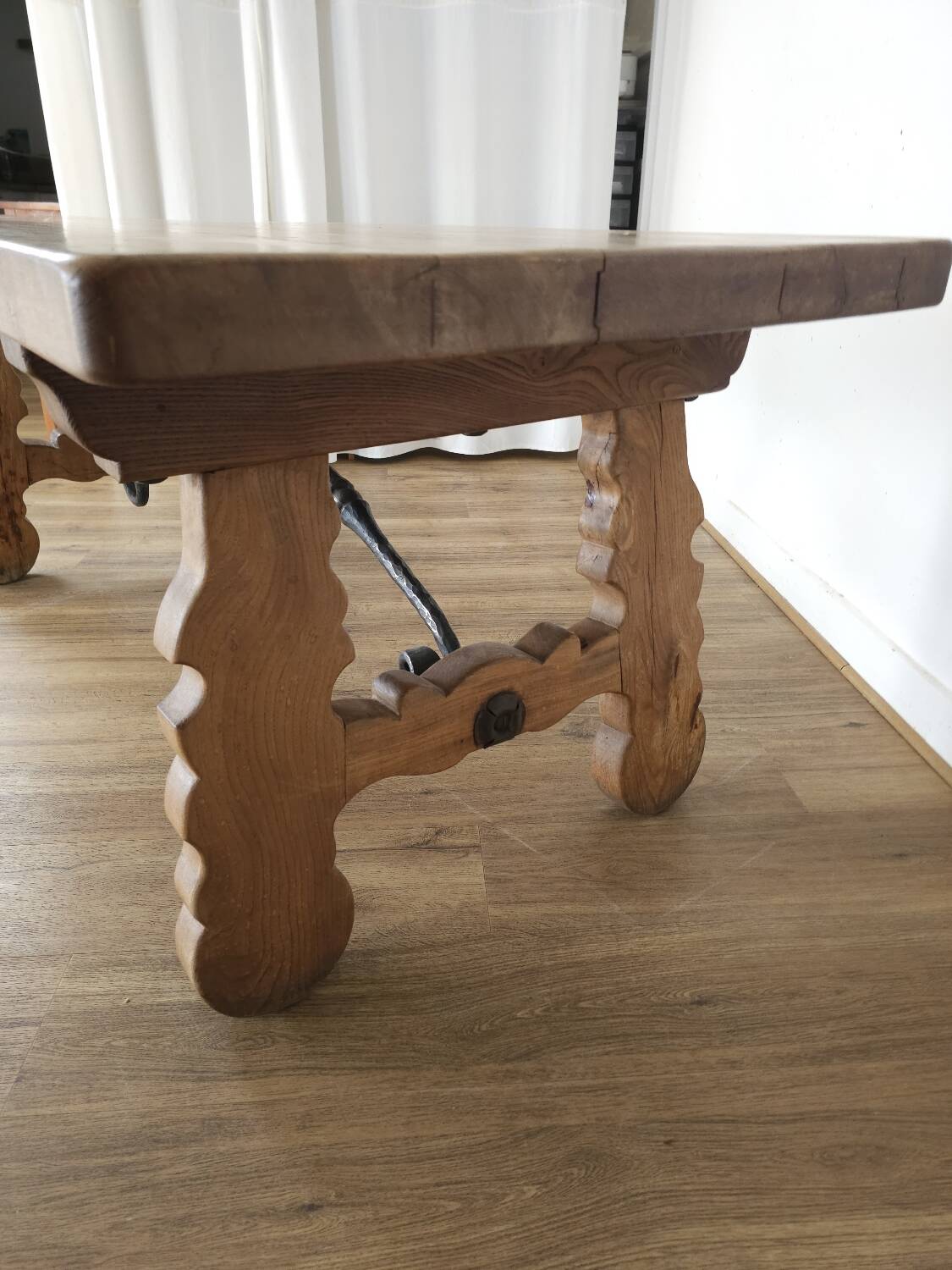 Rustic solid oak table with wrought iron, circa 1950.