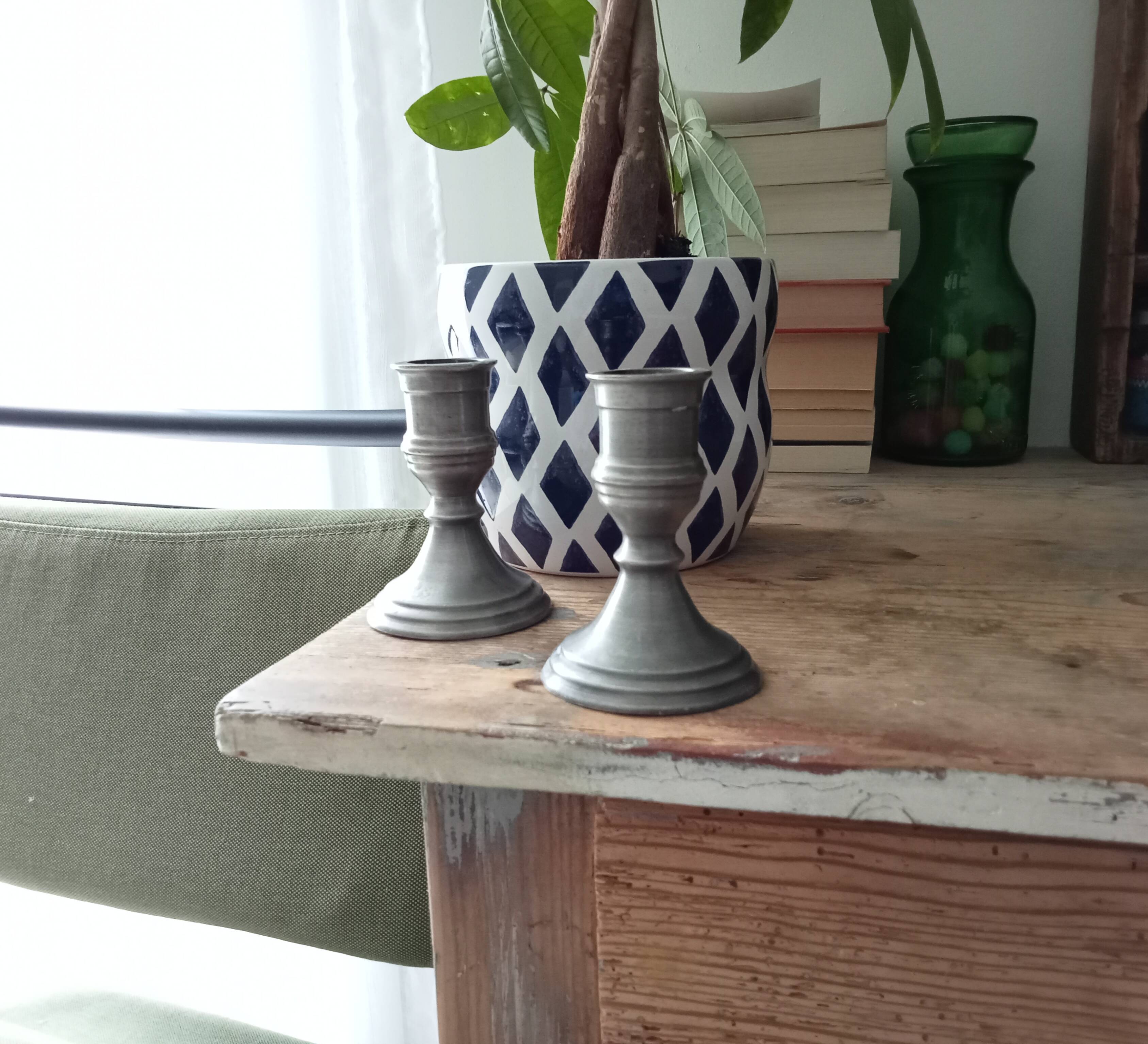 Pair of antique pewter candle holders