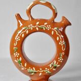 Circular glazed terracotta gargoulette