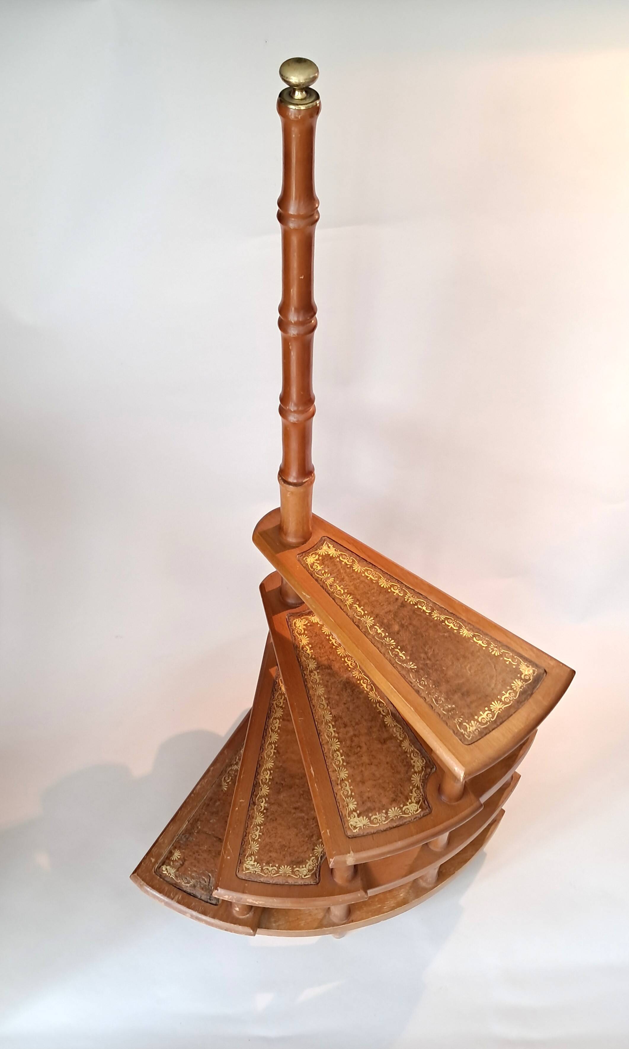 Library spiral staircase in beech and brown leather.
