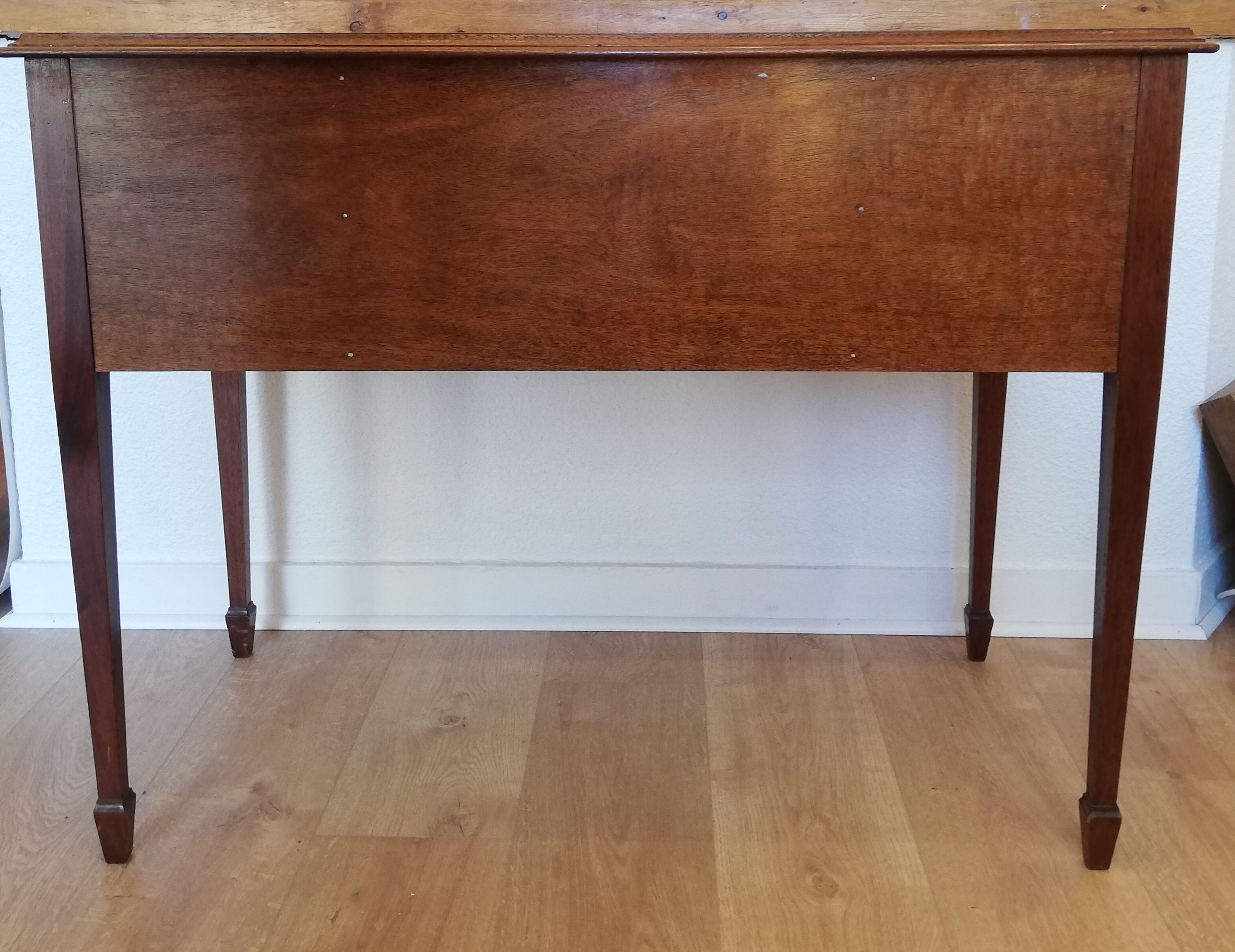 English wooden desk on top of leather