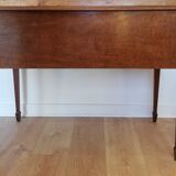 English wooden desk on top of leather