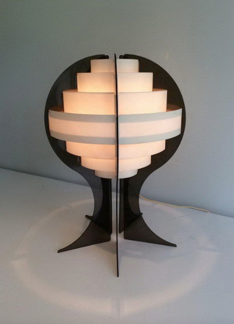 Modernist lamp in plexiglass and white plastic strips.