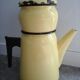 Coffee maker in yellow vintage enamel