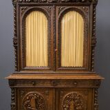 Two-body buffet in solid oak, richly carved in the Renaissance style.