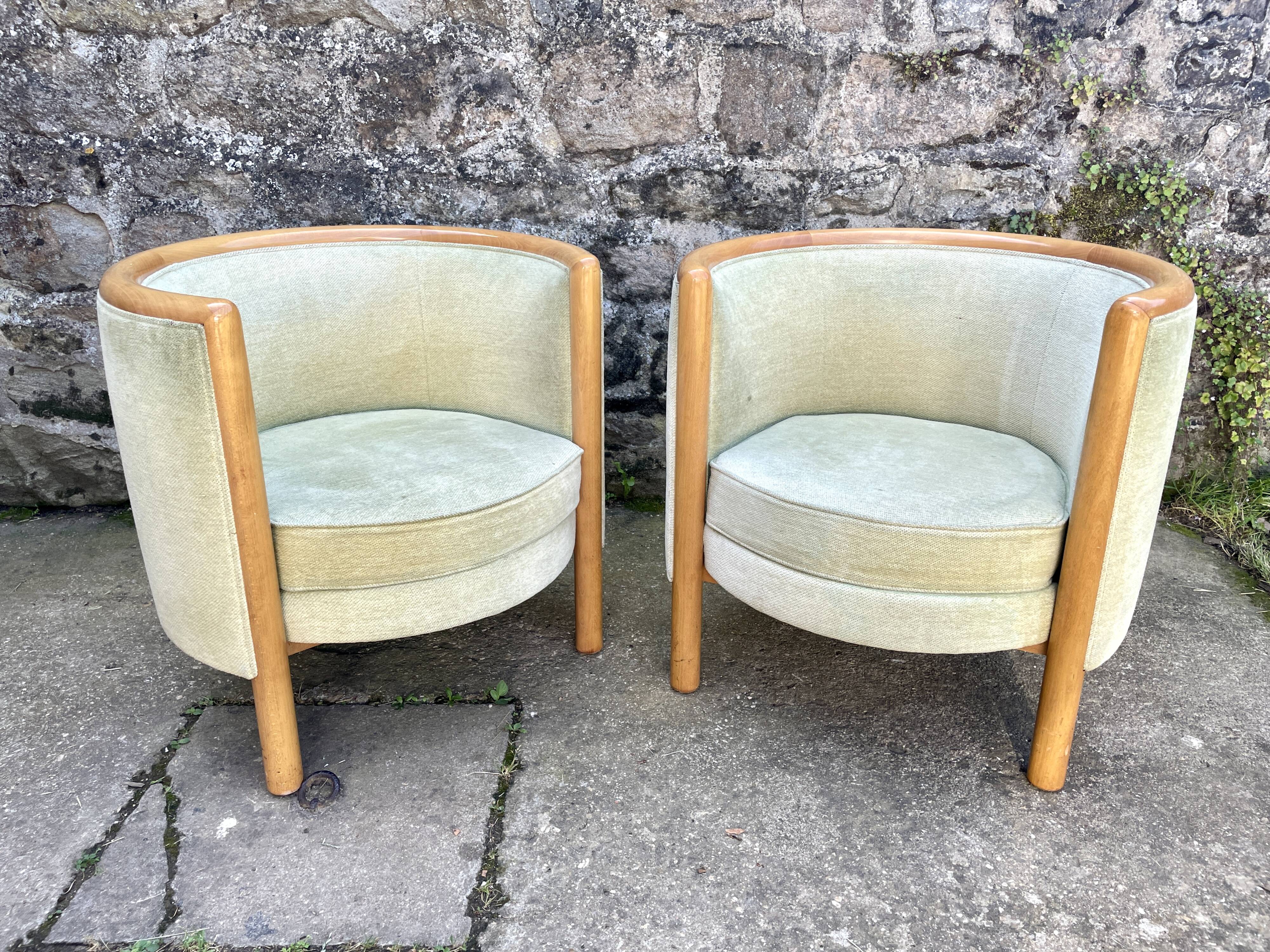 Pair of barrel-shaped armchairs in beech and almond green velvet by Maison Rosello