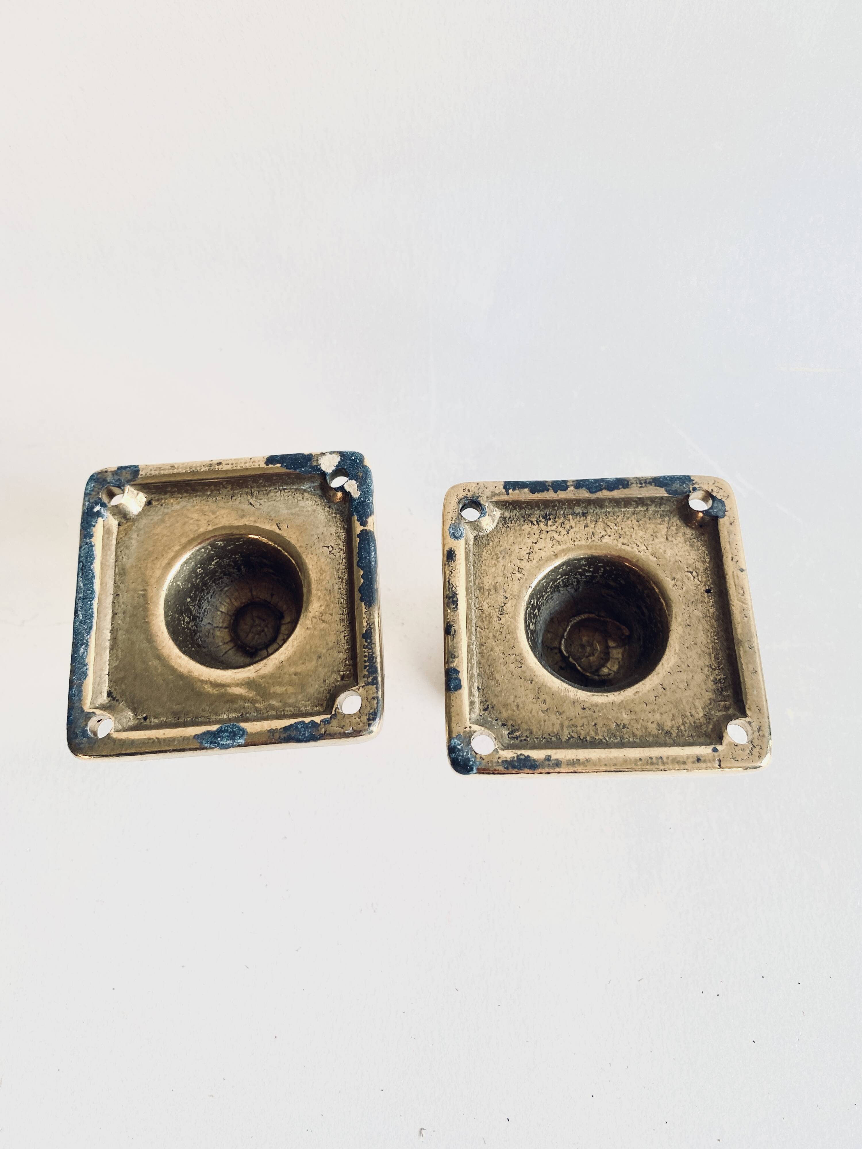 Pair of golden cast iron hooks