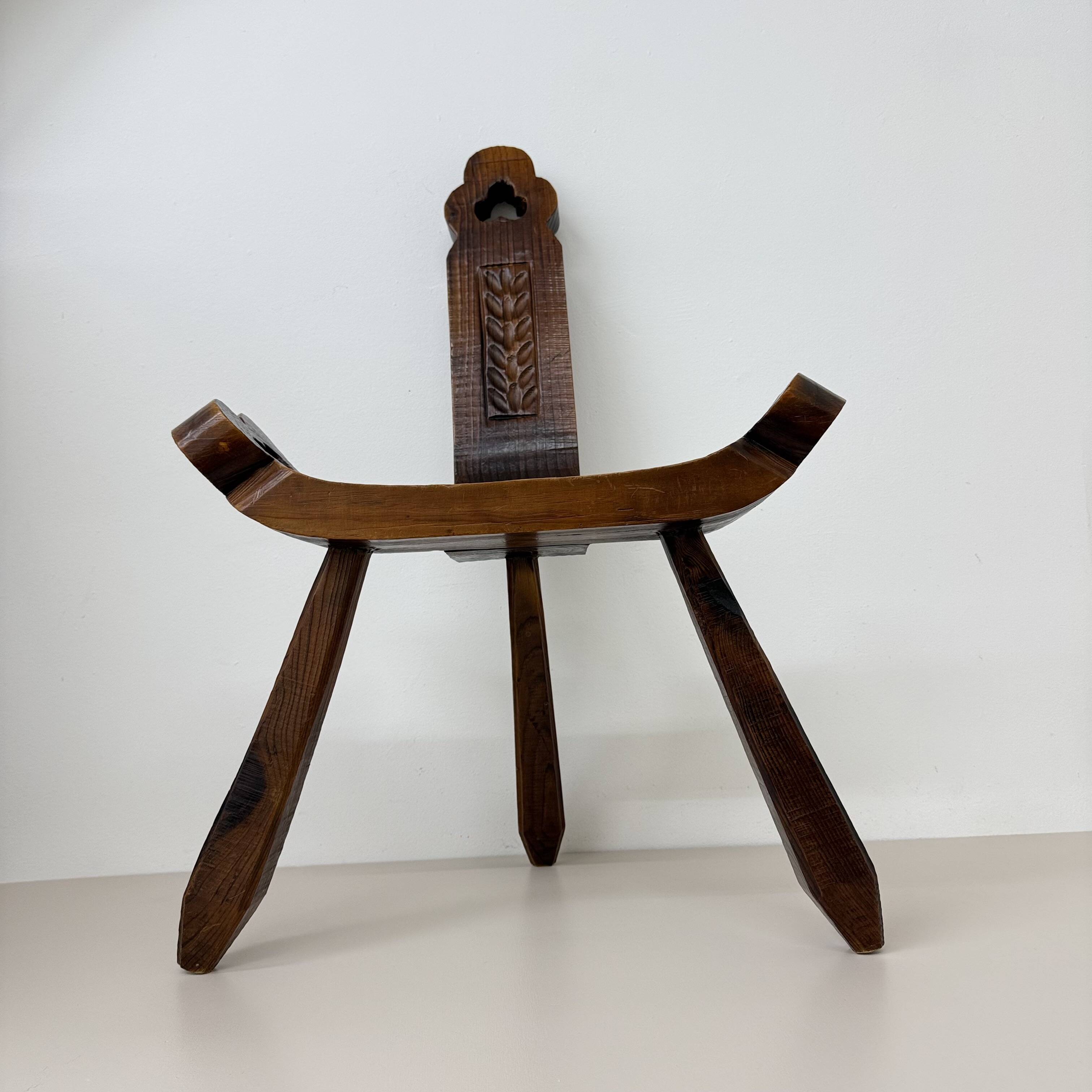 Brutalist hand carved oak Spanish tripod chair , 1970s