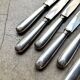 6 dessert knives by Christofle in silver-plated metal, shell decoration.