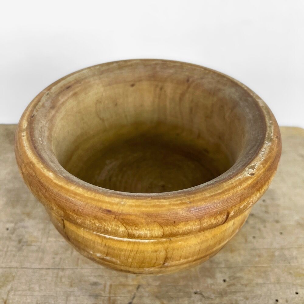 Mortar and old pestle made of olive wood