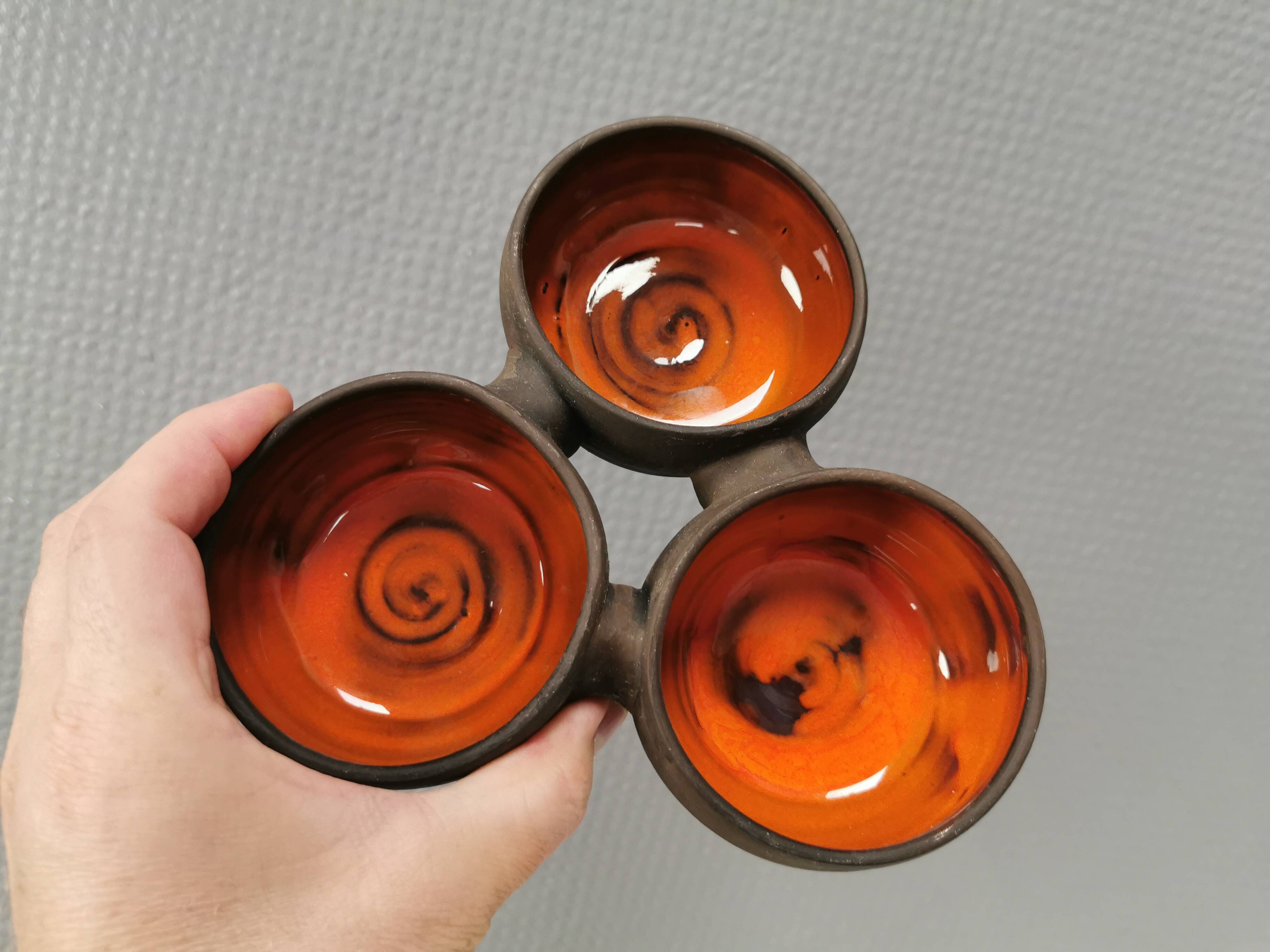 Beautiful bowl (composed of 3 bowls) with orange/red glaze inside
