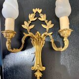 Pair of double sconces in gilded bronze