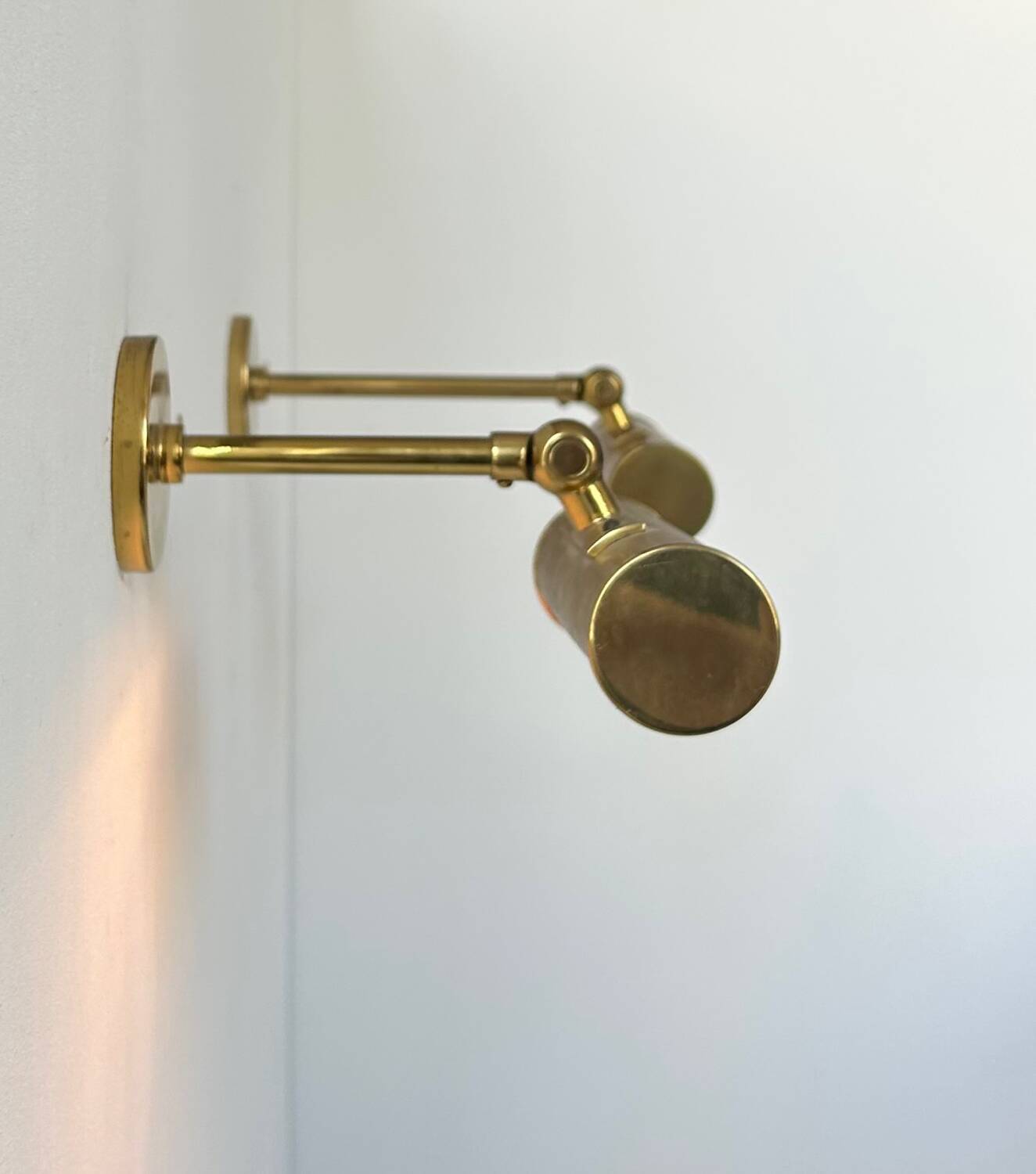 Pair of vintage adjustable wall lights, solid brass, France 1950
