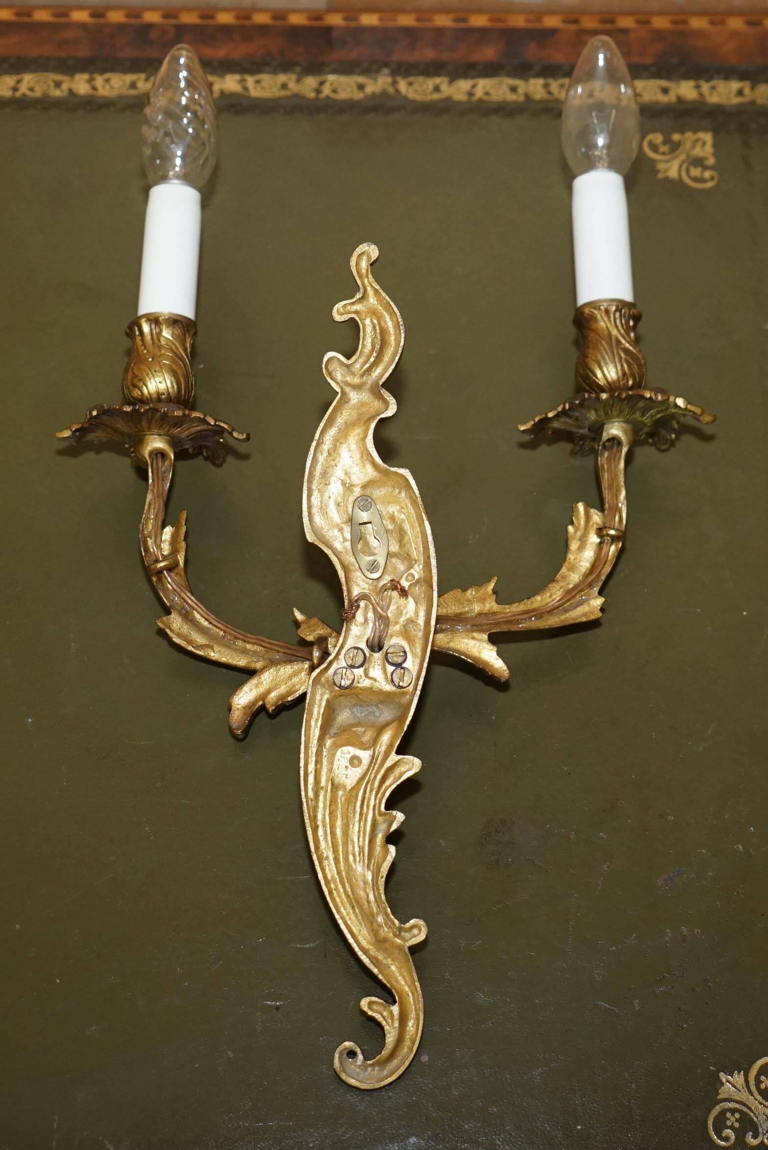 Pair of antique French wall sconces, gilded and bronzed, from the 1920s.